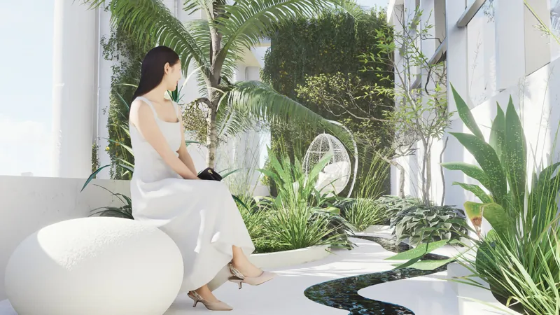 Jardín de invierno: vegetación interior y asientos blancos bajo la cubierta de vidrio