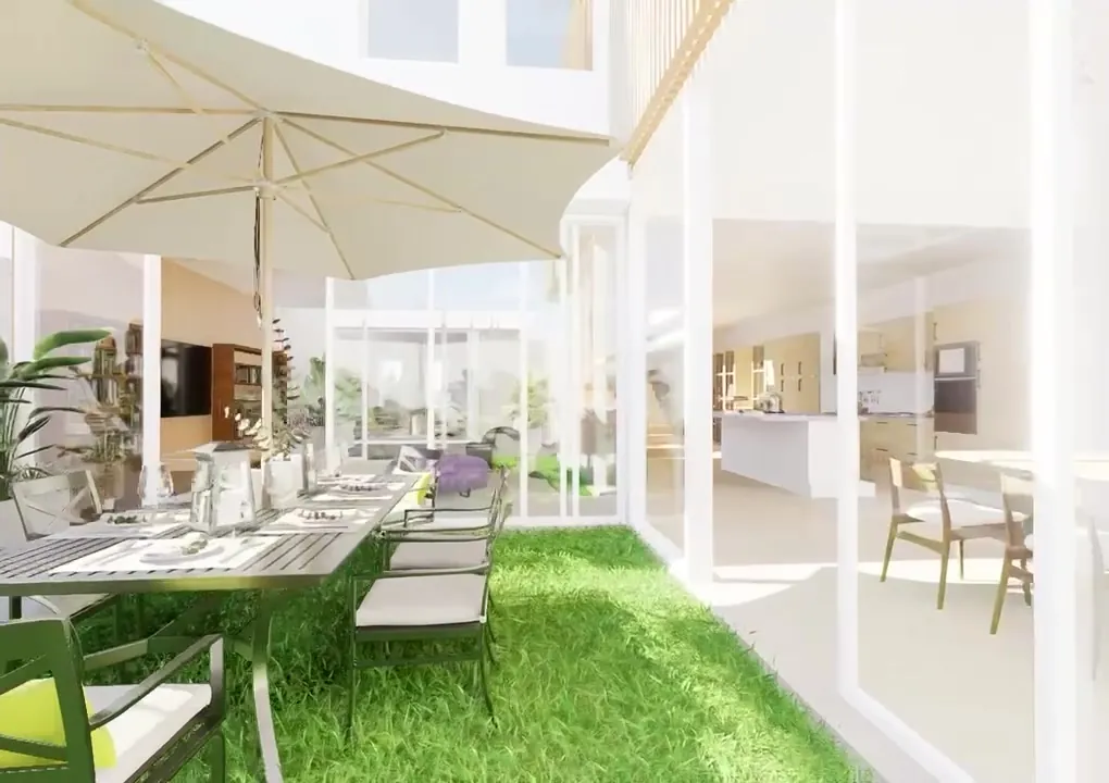Reforma de vivienda con carpinterías de suelo a techo abiertas al patio